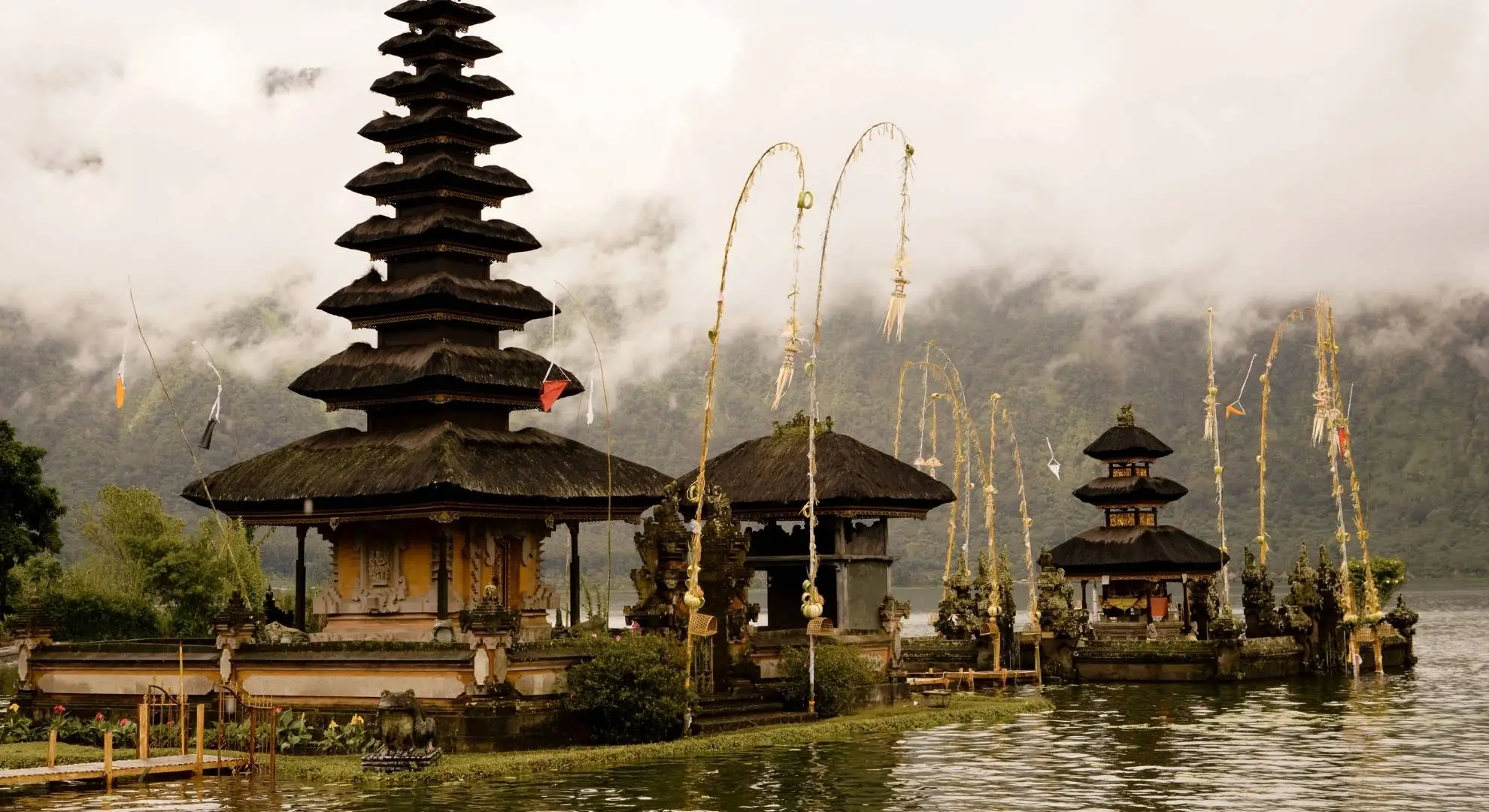 Ulun Danu Beratan temple rising from misty Lake Bratan in Bali, a premier luxury private jet destination in Indonesia