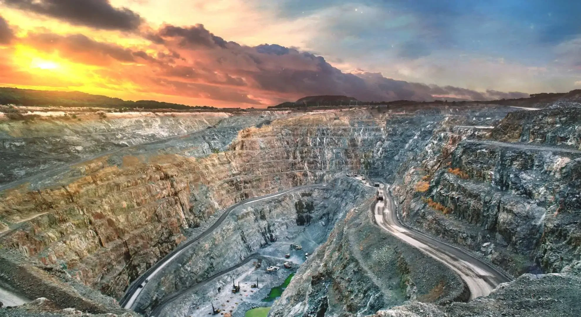 Aerial view of a mine in Indonesia at sunset, illustrating remote mining site access served by private jet charter flights