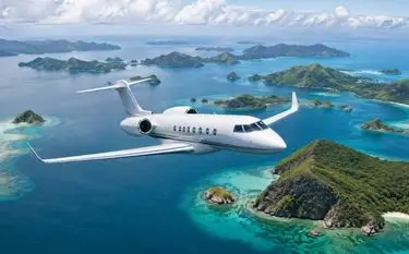 Private jet flying between islands in Indonesia