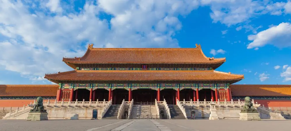 Majestic Forbidden City palace with traditional Chinese architecture under blue sky in Beijing, China
