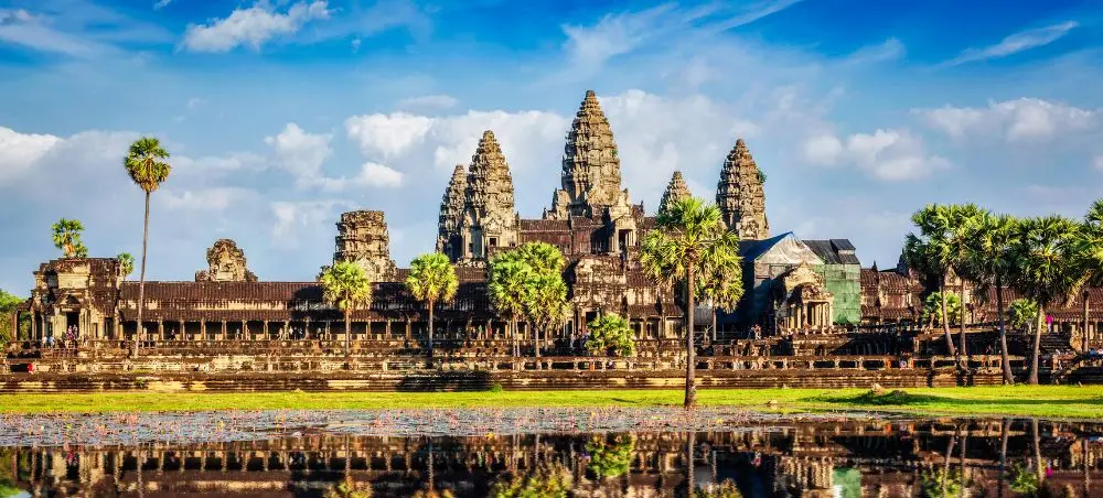 Angkor Wat temple complex reflected in water showcasing Cambodia's ancient Khmer architecture and heritage