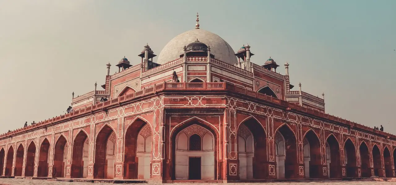 Magnificent Mughal architecture of Humayun's Tomb in Delhi showcasing red sandstone arches and marble dome