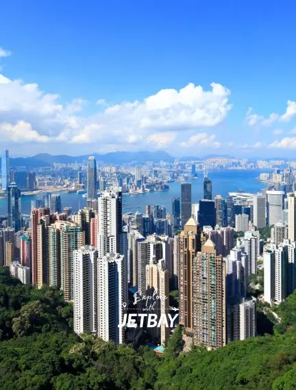 Hong Kong skyline showcasing towering skyscrapers and Victoria Harbour from elevated viewpoint