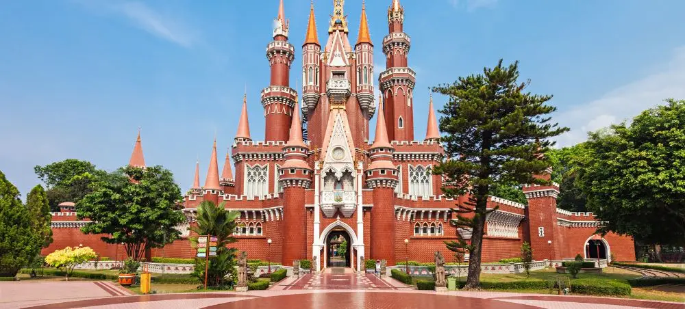 Enchanted Kingdom castle with red brick towers and spires in Jakarta, Indonesia theme park destination