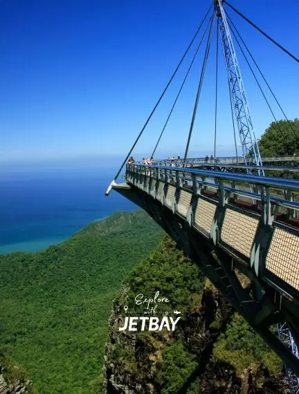 Langkawi Sky Bridge suspended over lush tropical rainforest with azure ocean views in Malaysia