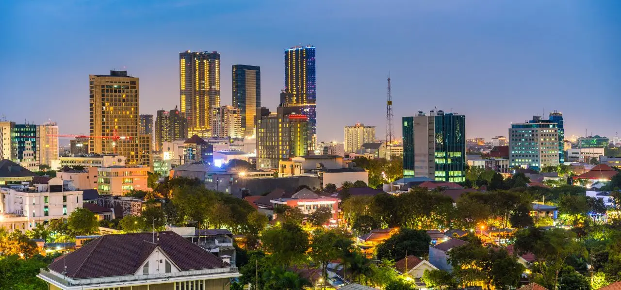 Surabaya city skyline at twilight showcasing illuminated skyscrapers and urban landscape in Indonesia
