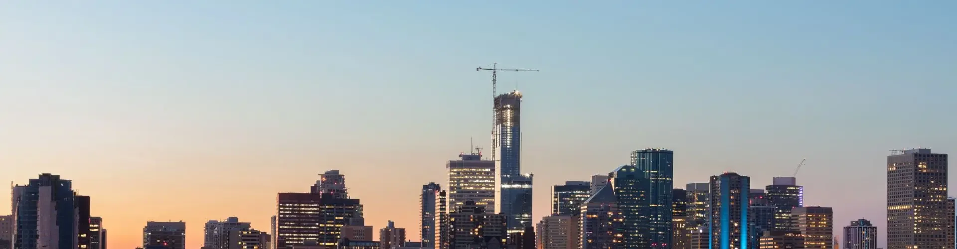 Private Jet Charter from Edmonton (CYEG) Edmonton skyline dusk illuminated walterdale bridge downtown towers private jet charter